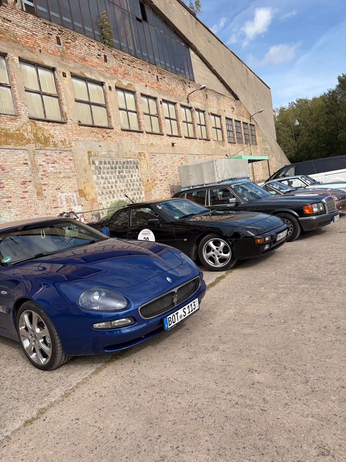 A row of modern classics and classic cars at Creme21 2026 in Pütnitz